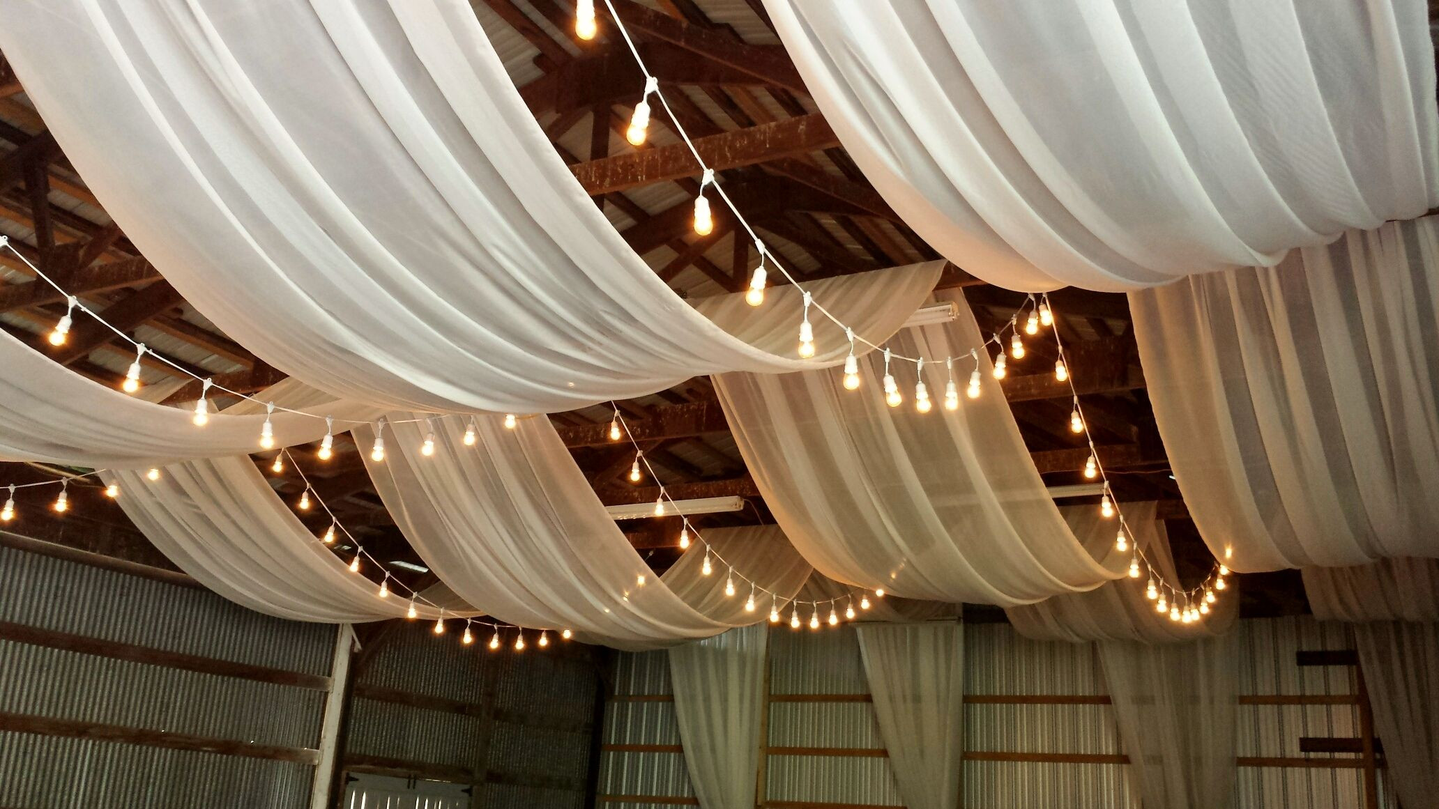 DIY Ceiling Draping For Weddings
 Ceiling draping in a barn This makes a rustic wedding