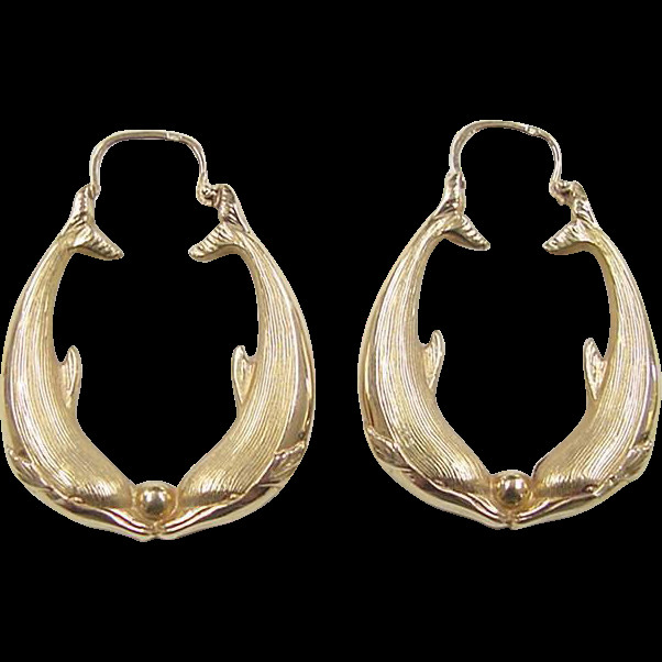 Gold Dolphin Earrings
 Vintage 14k Gold Dolphin Hoop Earrings from arnoldjewelers