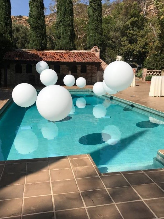 Baby Pool Party Ideas
 Jumbo balloons over this pool create a magical look for