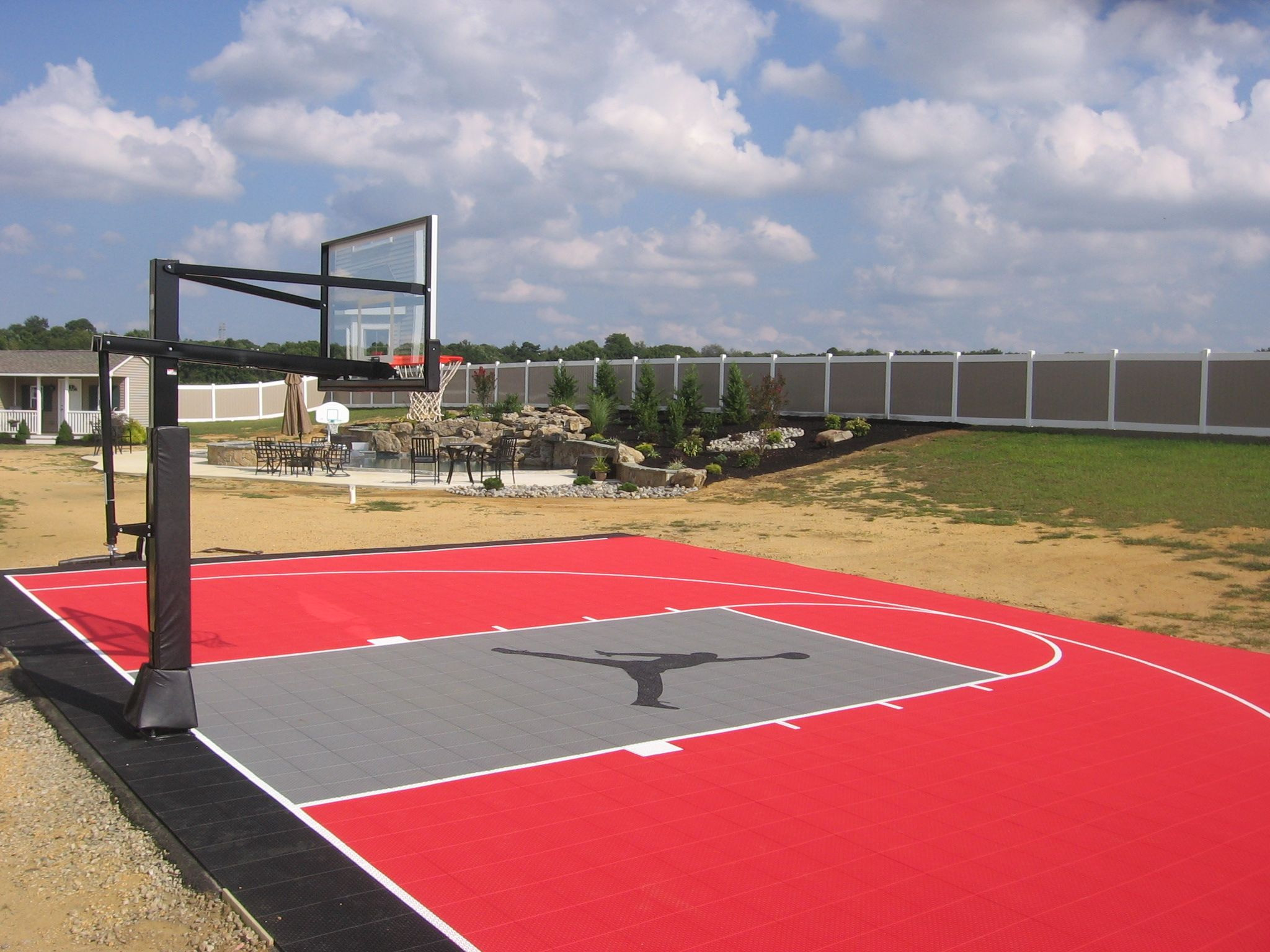 Backyard Half Court Basketball
 Backyard half basketball court with custom logo built by