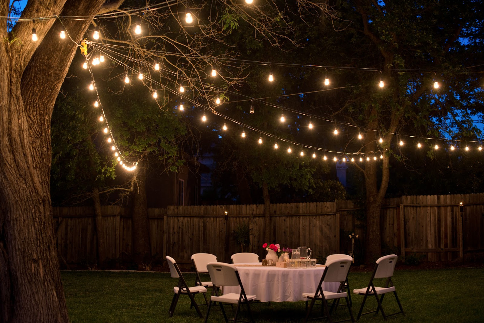 Backyard Party Lighting Ideas
 Domestic Fashionista Backyard Anniversary Dinner Party