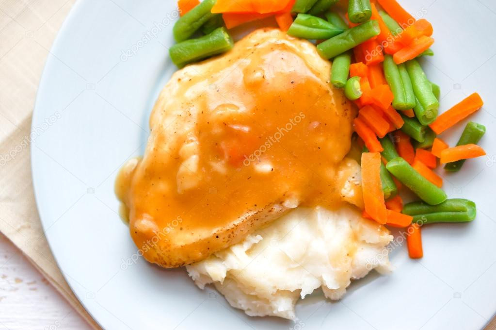 Baked Chicken And Gravy
 Oven baked chicken in gravy with mashed potatoes and