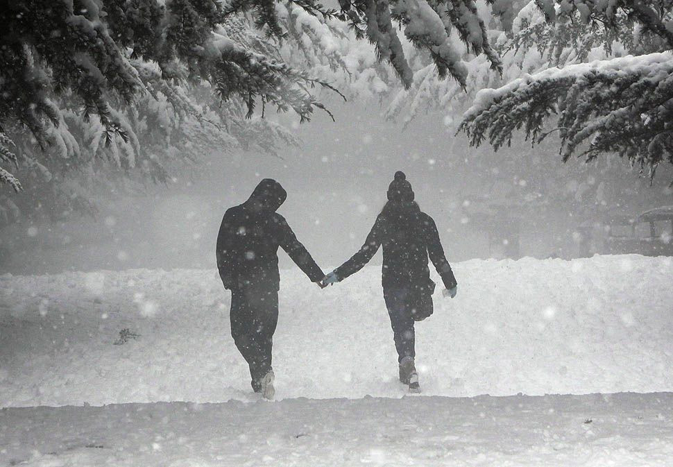 Boston Date Ideas Winter
 holding hands in the snow