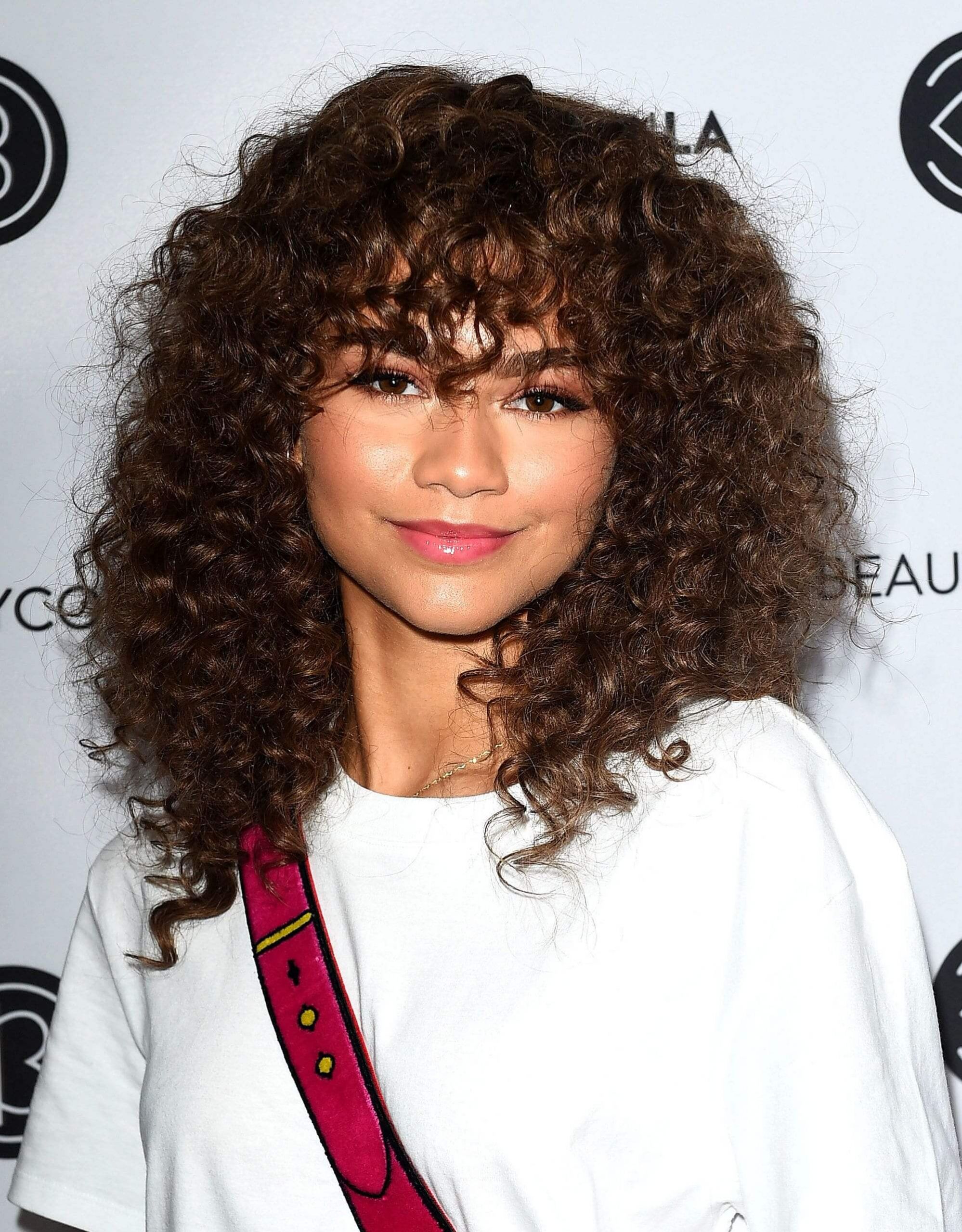 Curly Hairstyles With Bangs
 Flaunt Your Curls with These 20 Curly Hairstyles with Bangs