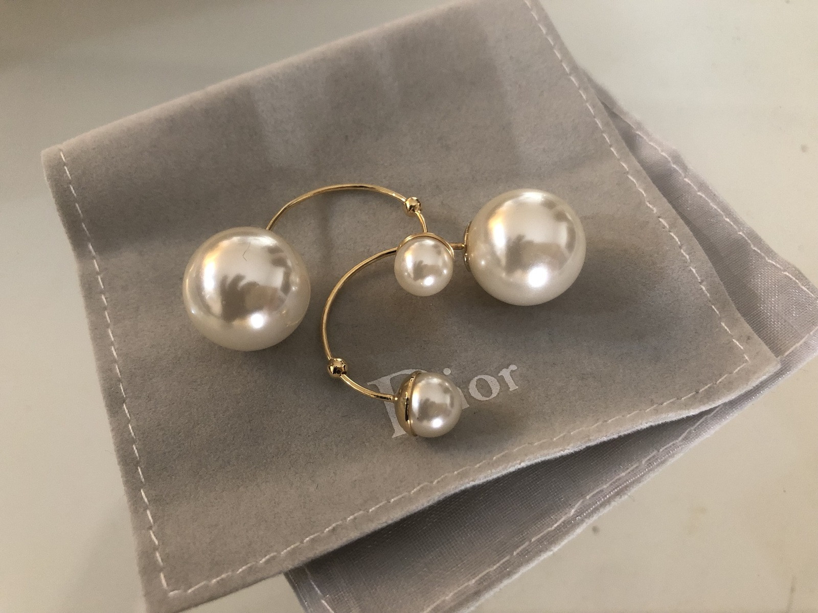 Dior Double Pearl Earrings
 AUTHENTIC CHRISTIAN DIOR MISE EN TRIBAL DOUBLE PEARL HOOP