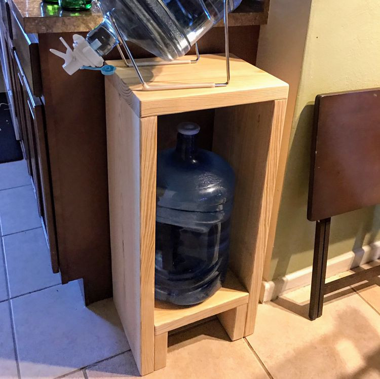 DIY 5 Gallon Water Bottle Rack
 Made a simple 5 Gallon water jug holder from one 2x12x8