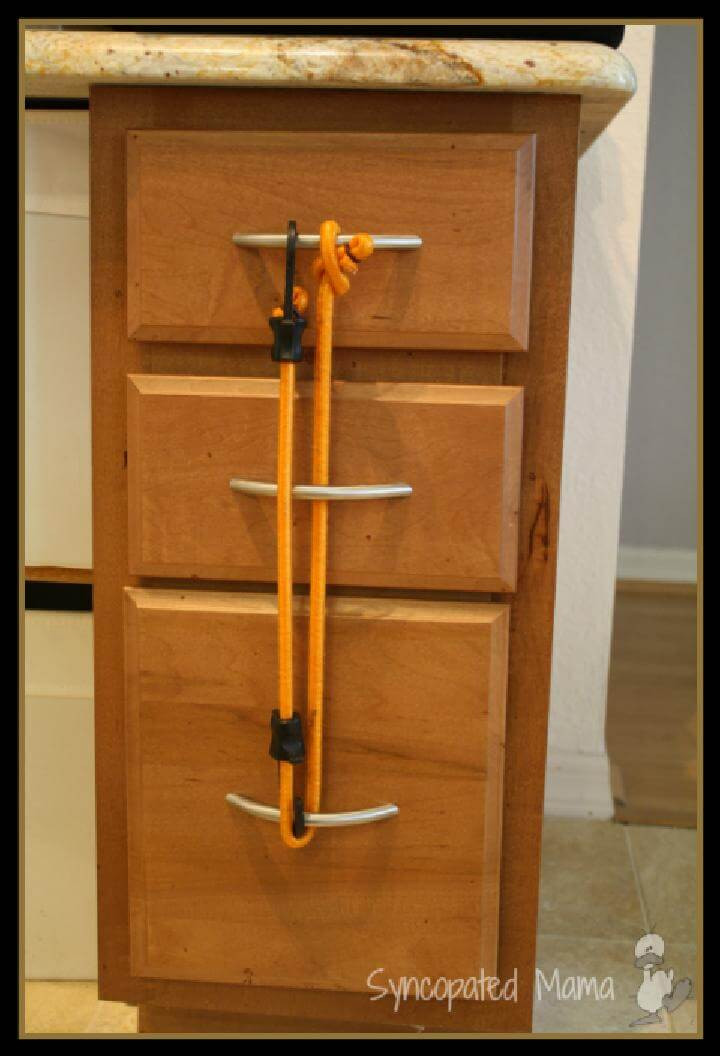 Diy Child Proof Cabinets
 28 Ways To Use Bungee Cords in Your Home DIY Bungee Cord