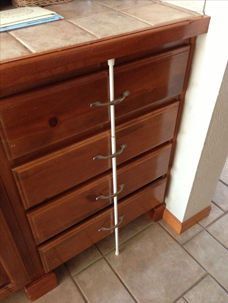 Diy Child Proof Cabinets
 Childproof drawers use a tension rod to keep little ones