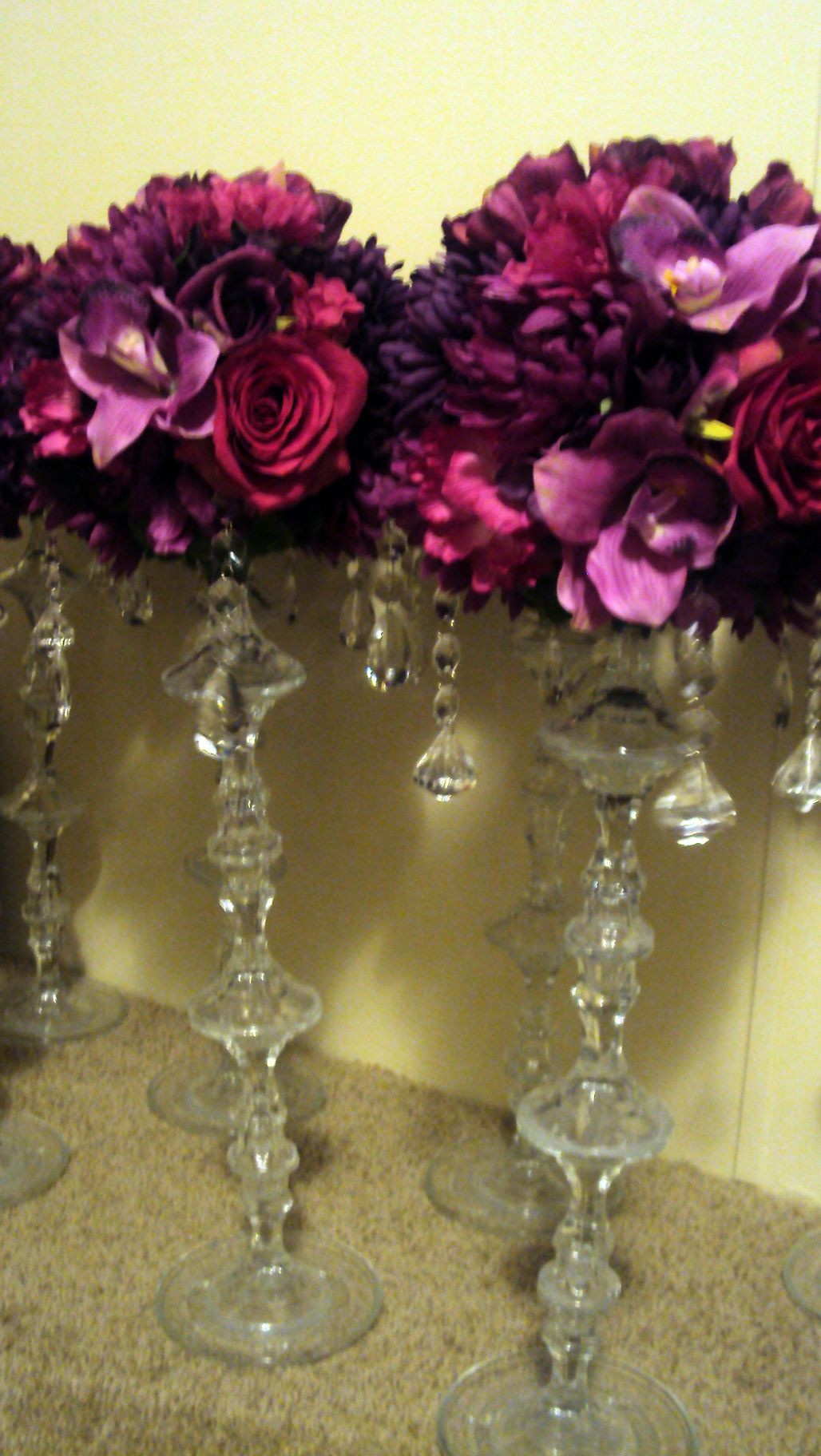DIY Dollar Store Wedding Centerpieces
 Deep purples add in some gold dollar store candle holders