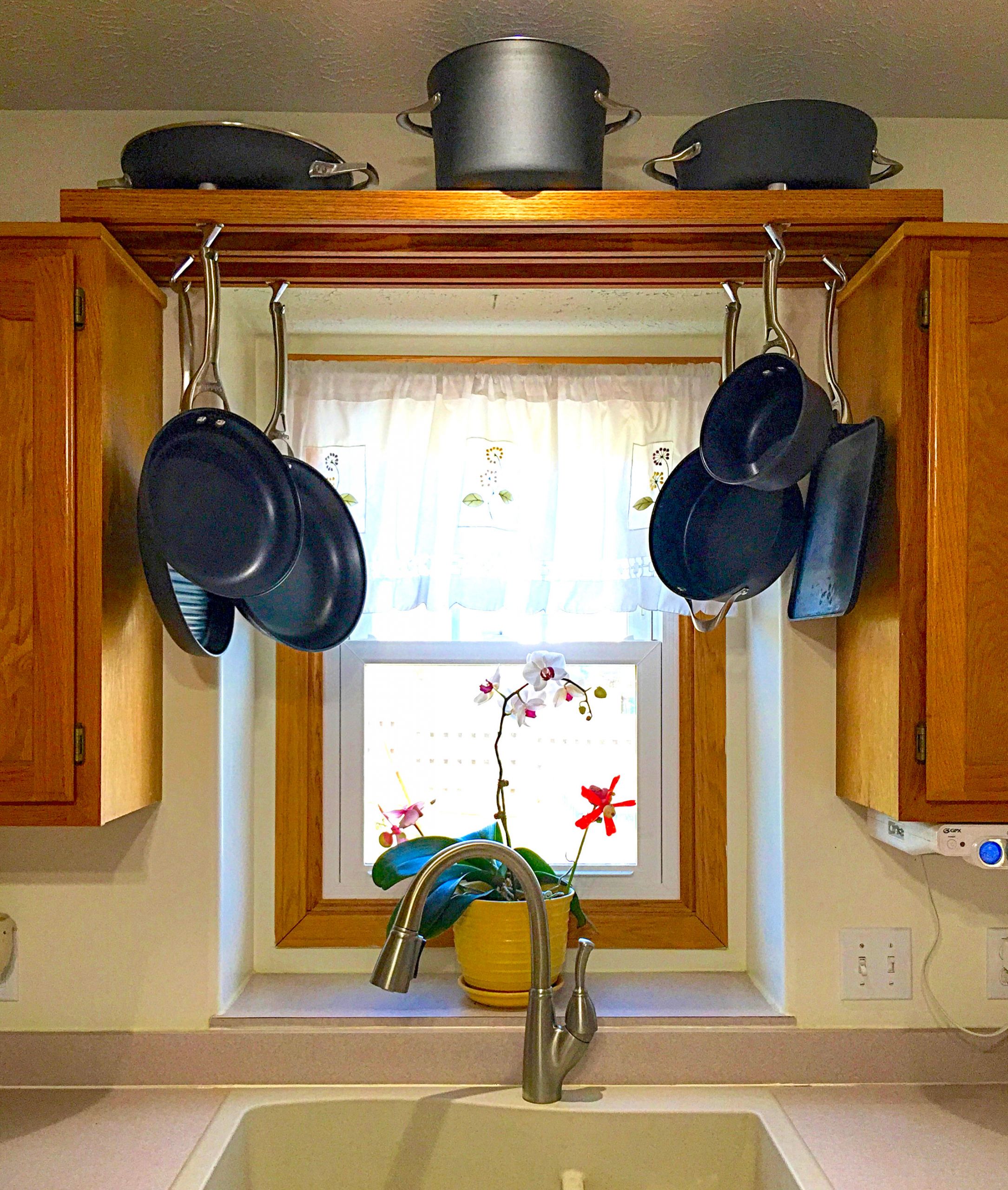 DIY Kitchen Pot Rack
 Make use of space over the kitchen sink with this DIY pot
