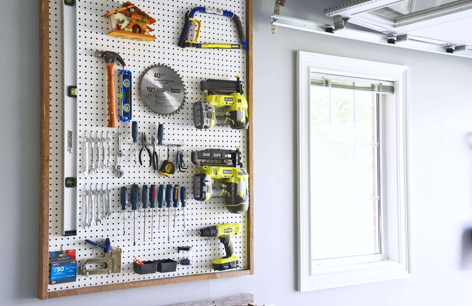 DIY Pegboard Tool Organizer
 Woman in Real Life Garage Organization DIY Pegboard