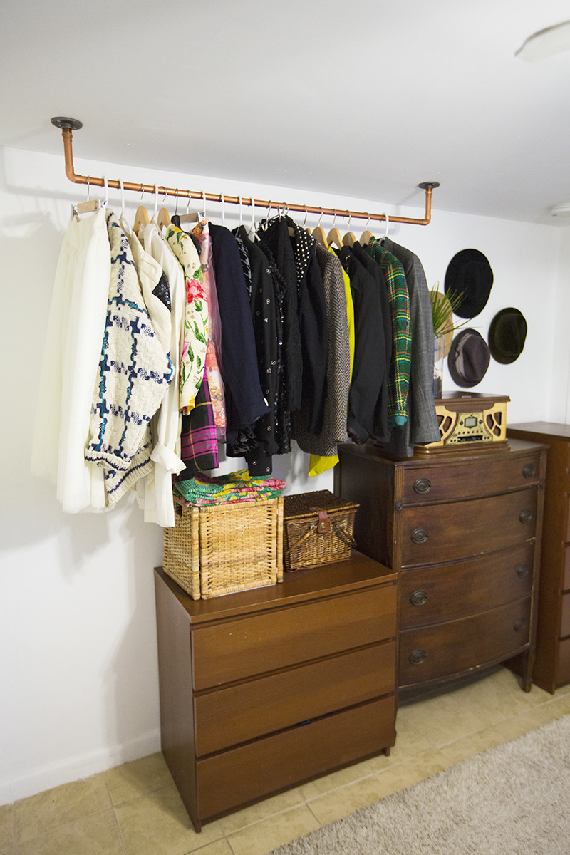DIY Pipe Clothes Rack
 Hanging Copper Pipe Clothing Rack DIY A Beautiful Mess