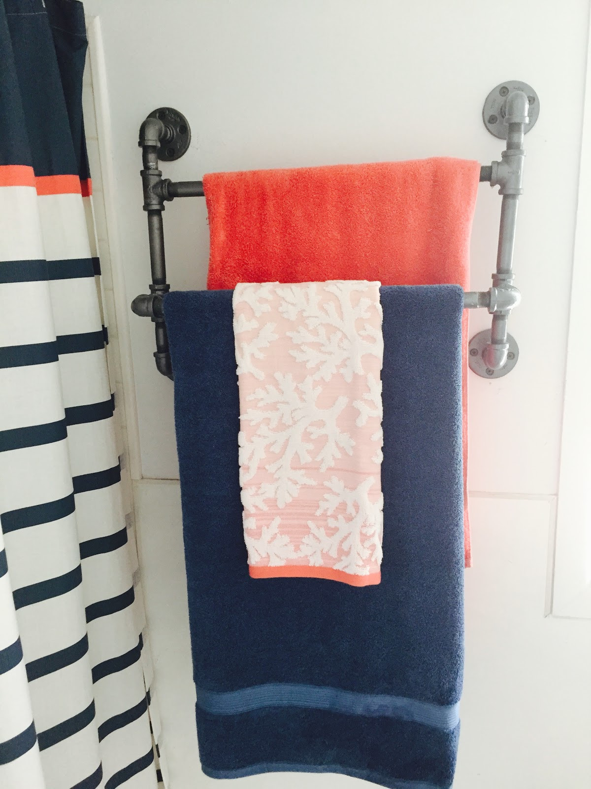 DIY Towel Racks
 Pipe towel rack DIY for small bathroom The Style Sisters