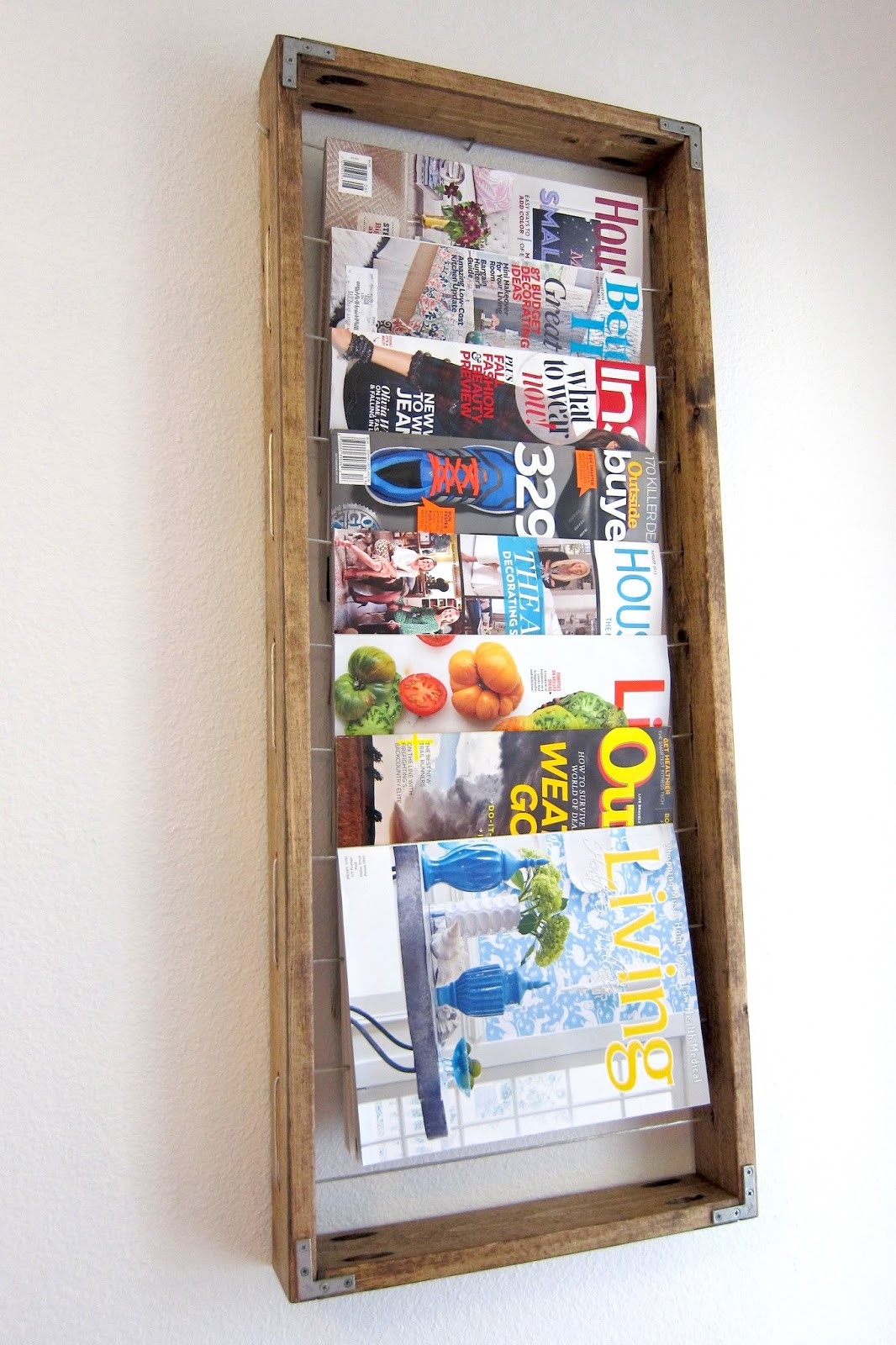 DIY Wall Magazine Rack
 Inspired Whims DIY Magazine Rack