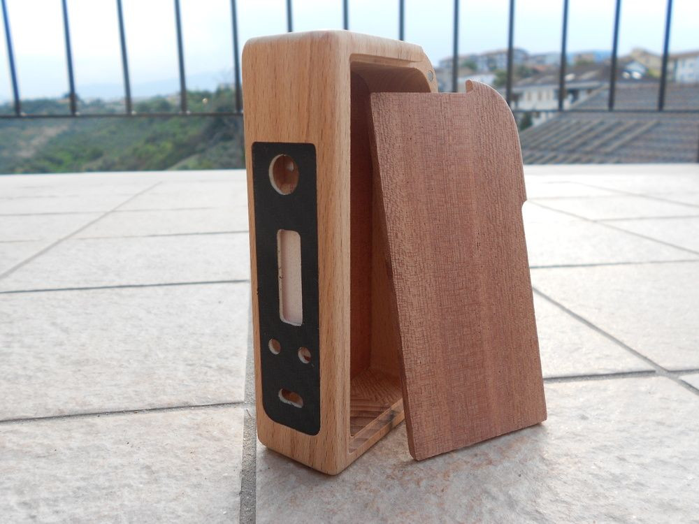 DIY Wooden Box Mod
 Drilled holes for Vamo style cap buttons on the face plate