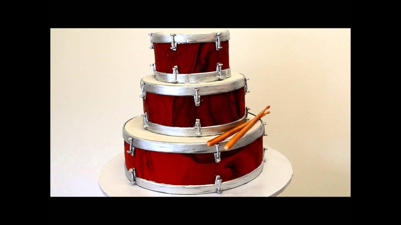 Drum Birthday Cake
 Three Tier Drum Cake Marble Fondant icing on the drums