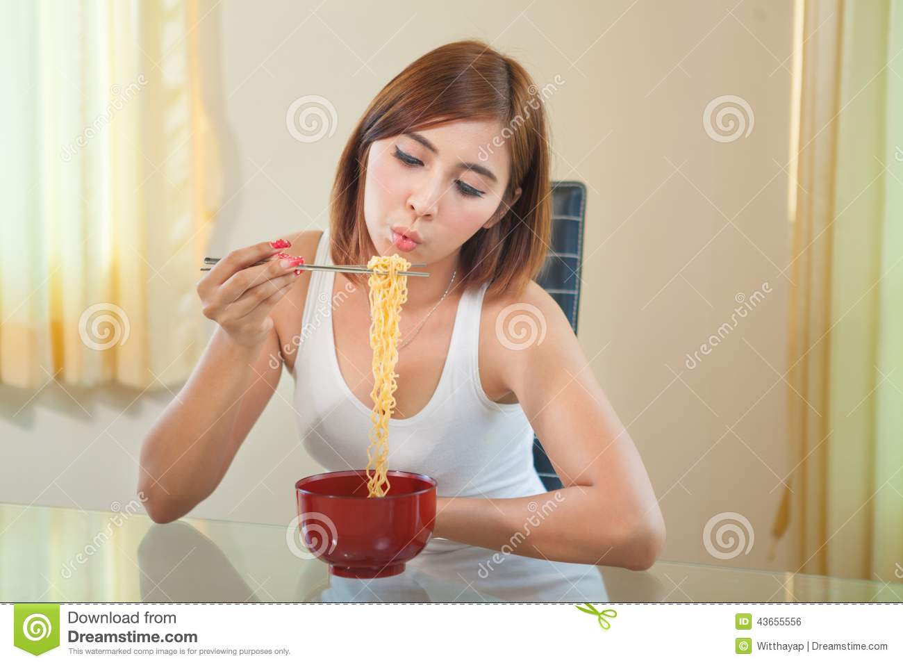 Eating Ramen Noodles
 Young Girl Eating Ramen Noodles Stock Image of