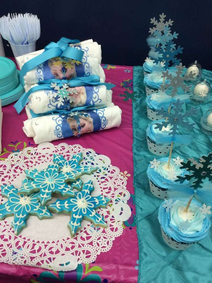 Elsa Birthday Party Supplies
 Snowflake cookies and cupcakes at a Frozen birthday party
