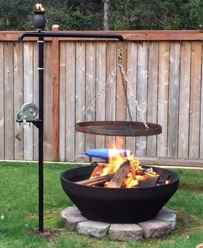 Firepit And Grill
 Build a fire pit with cooking grill in your backyard