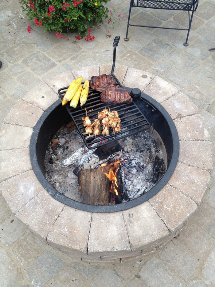 Firepit And Grill
 Build a fire pit with cooking grill in your backyard