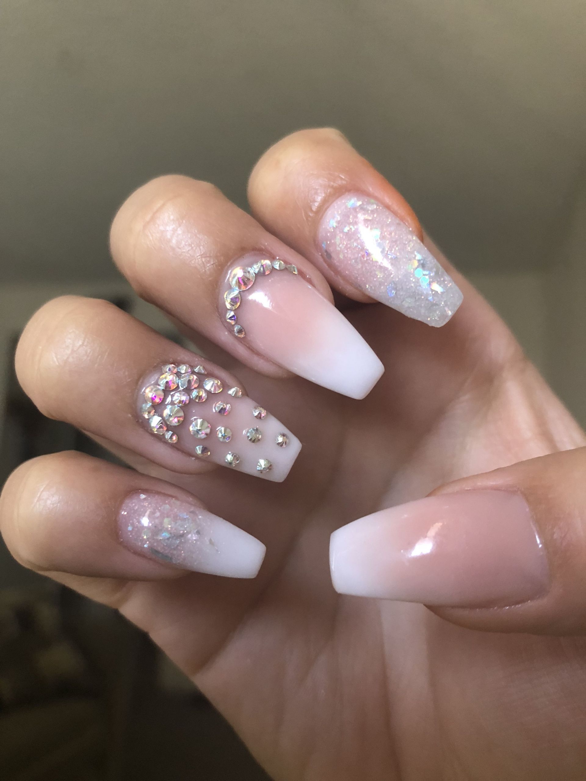 French Ombre Nails With Glitter
 French ombré coffin shaped nails with rhinestone & glitter