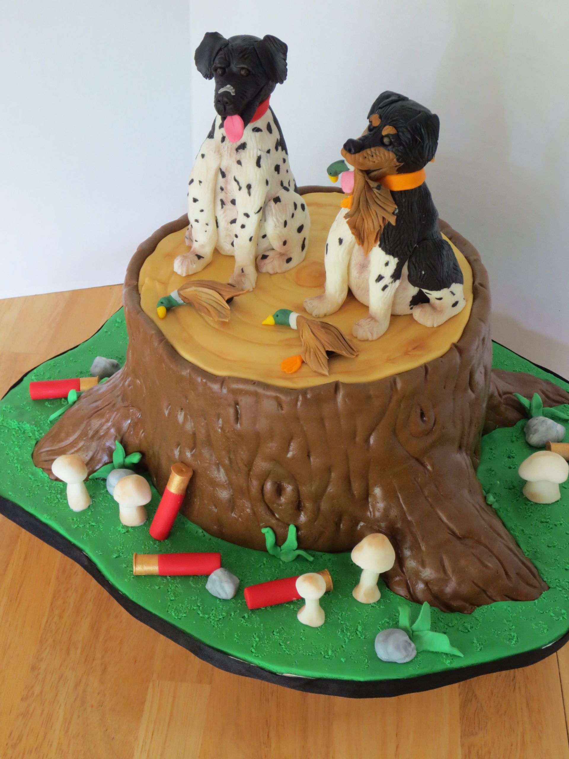 Hunting Birthday Cake
 Modeling Chocolate Hunting Dogs on Tree Trunk Grooms Cake