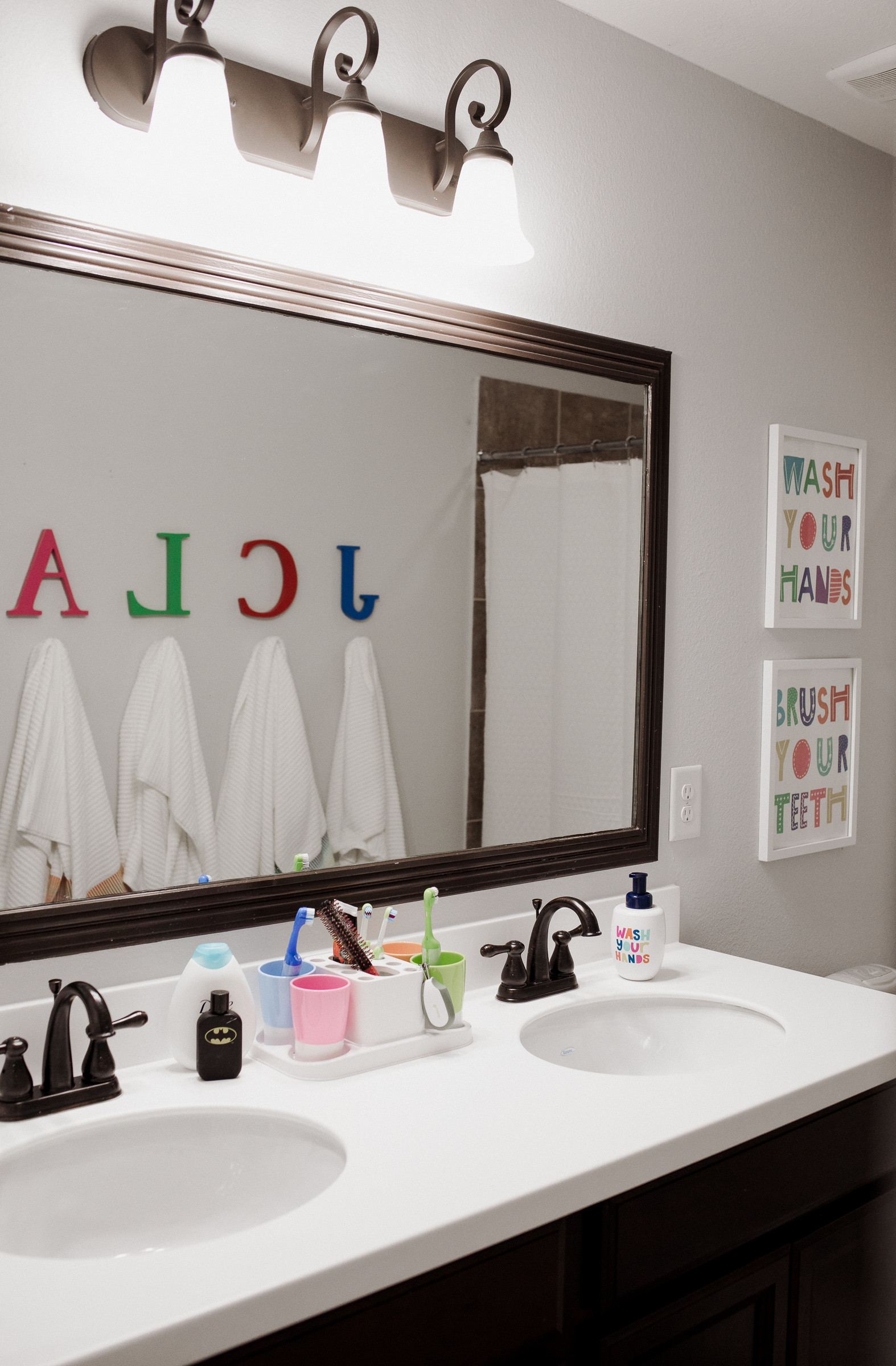 Kids Bathroom Art
 Our Kids d Bathroom Decor Makeover Uptown with Elly