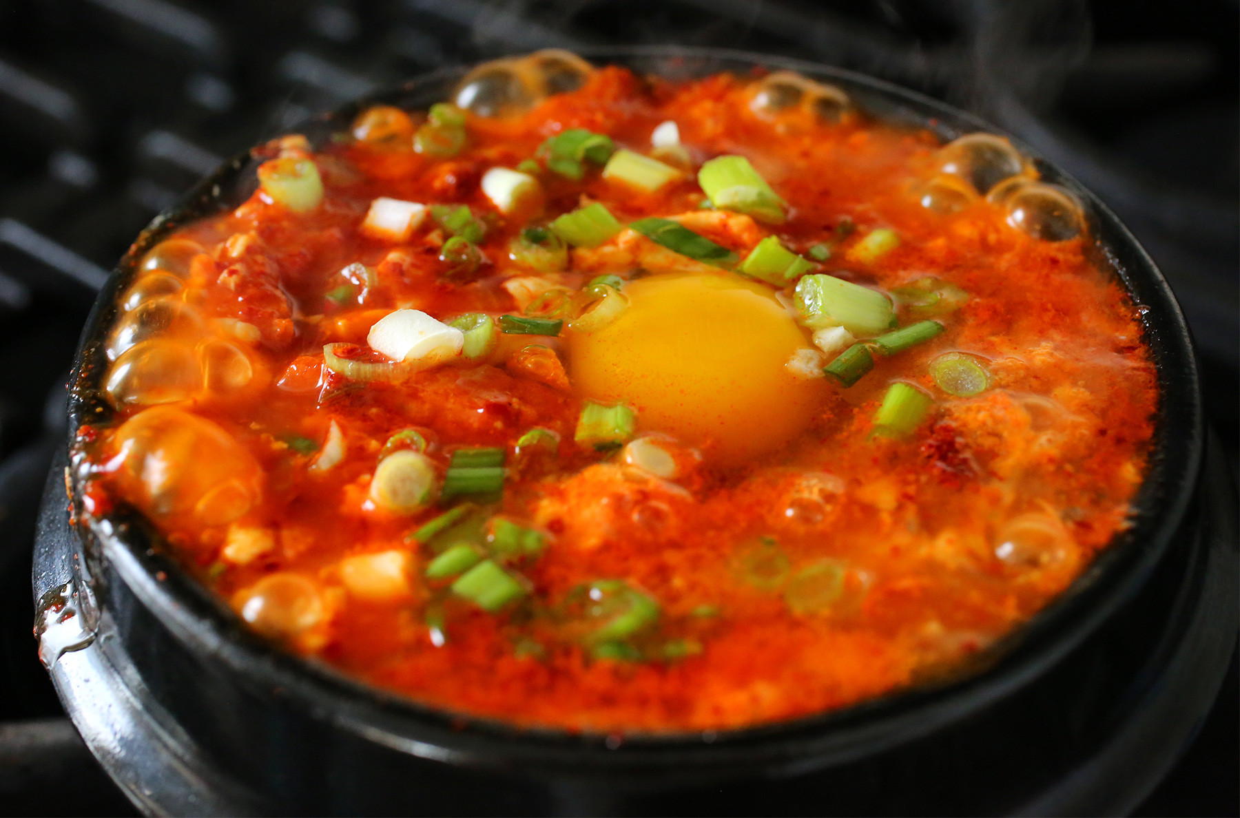 Kimchi Tofu Stew
 Spicy soft tofu stew with kimchi and pork belly recipe
