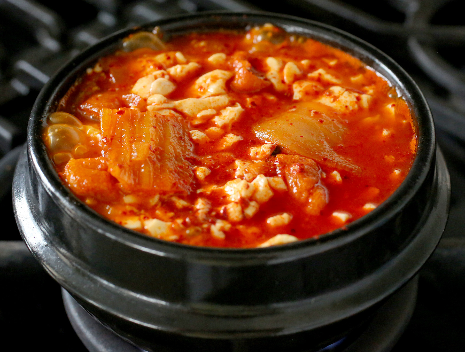 Kimchi Tofu Stew
 Spicy soft tofu stew with kimchi and pork belly recipe