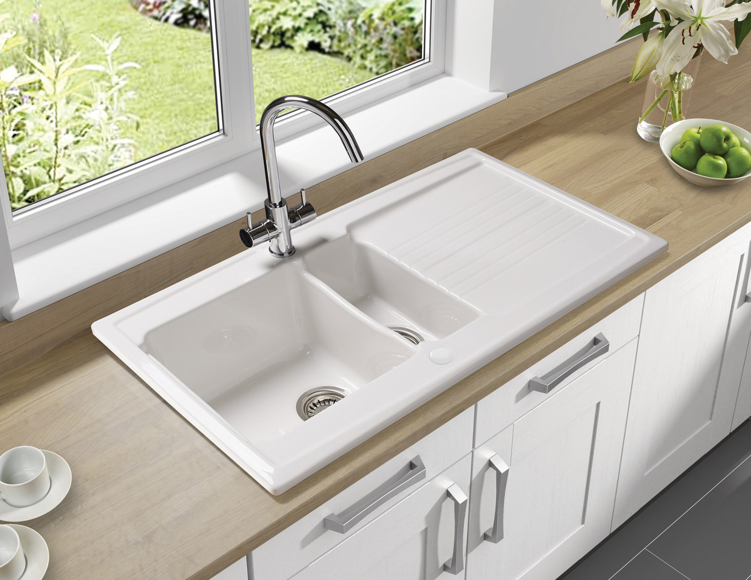 white kitchen sink with white countertop