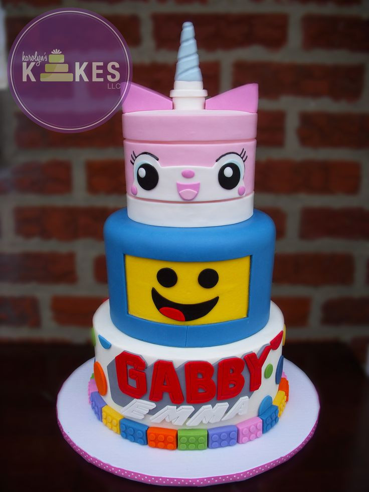 Lego Movie Birthday Cake
 Lego Movie cake Unikitty and Benny are covered in