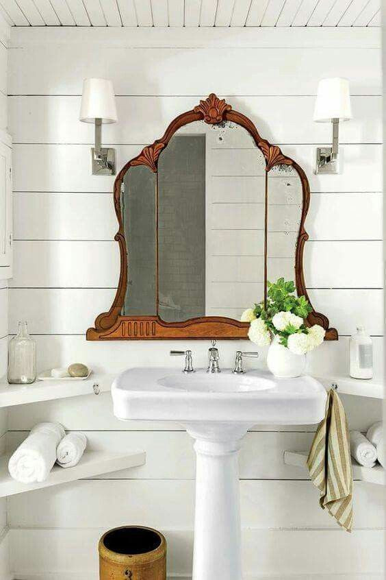 Mirrors Over Bathroom Sinks
 Vintage mirror above pedestal sink in bathroom