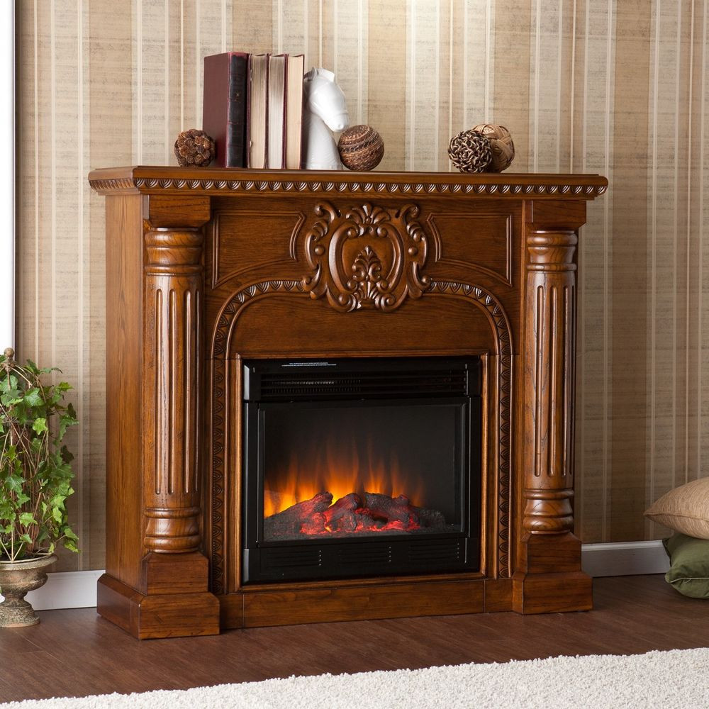Oak Electric Fireplace
 SEI Romano ELECTRIC FIREPLACE w REMOTE Antique Oak Ornate