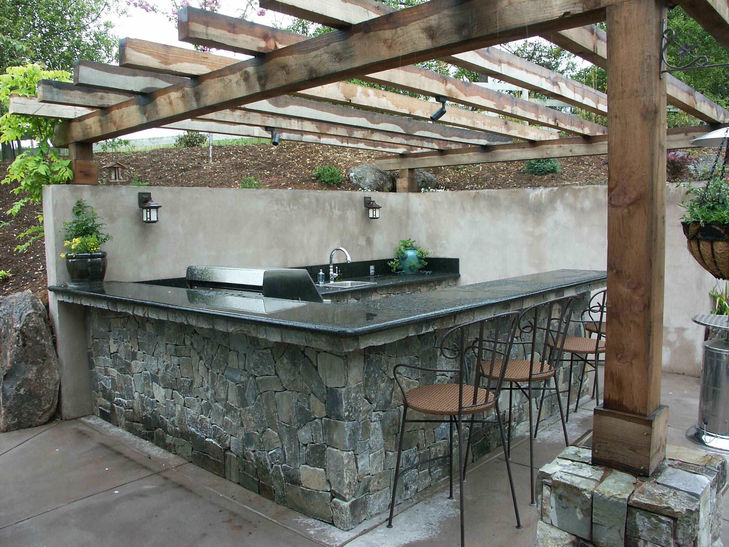 Outdoor Kitchen Stone Veneer
 Outdoor kitchen cut into slope Stone veneer finish with
