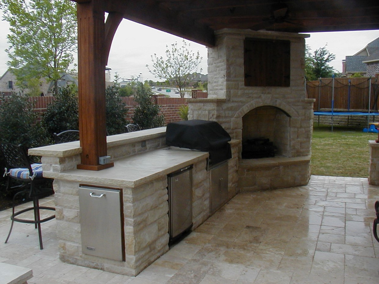 Outdoor Kitchen With Fireplace
 Interior Corner Kitchen with Corner Range and Fireplace