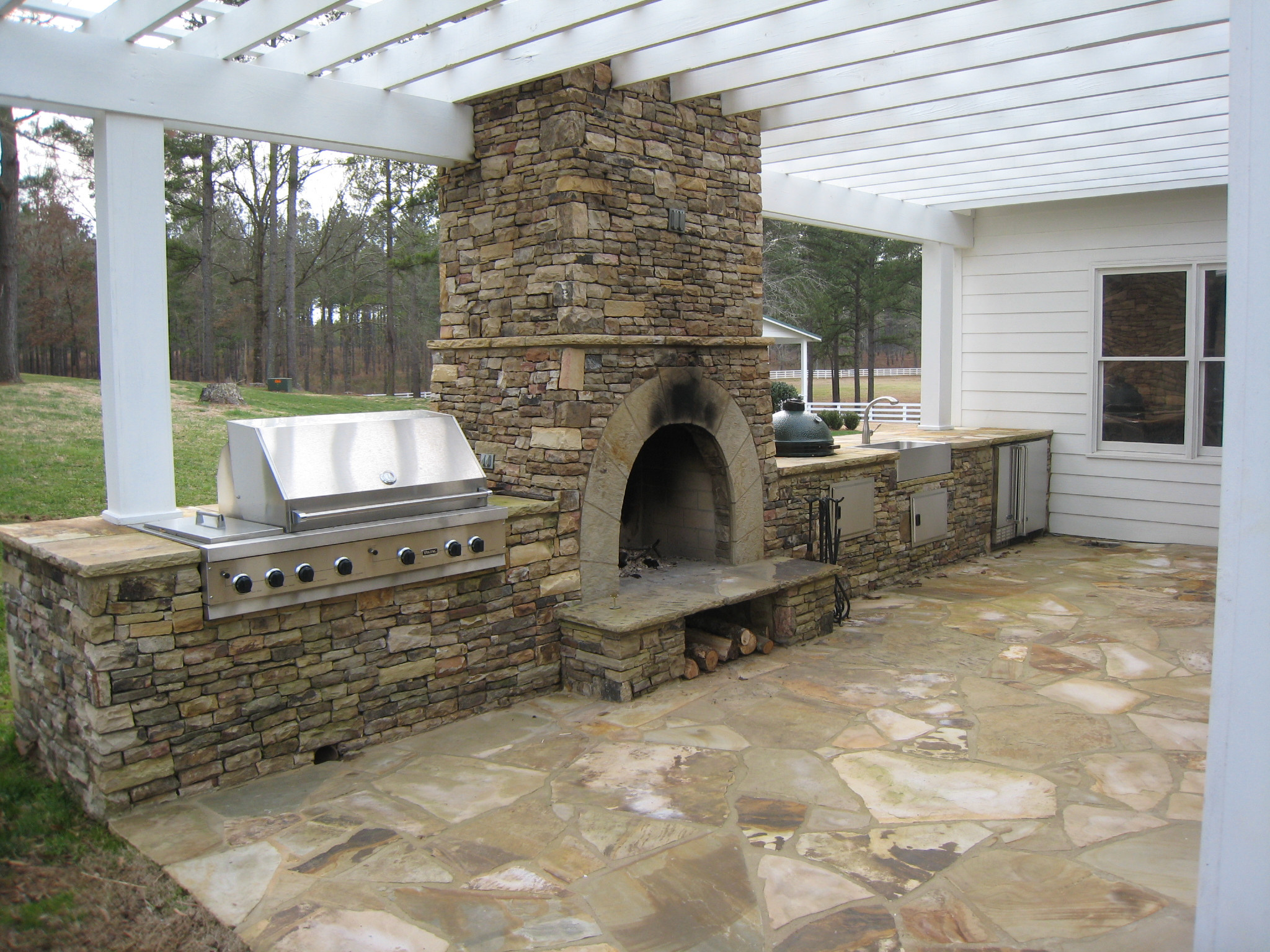 Outdoor Kitchen With Fireplace
 Outdoor Kitchens & Stone BBQ Design