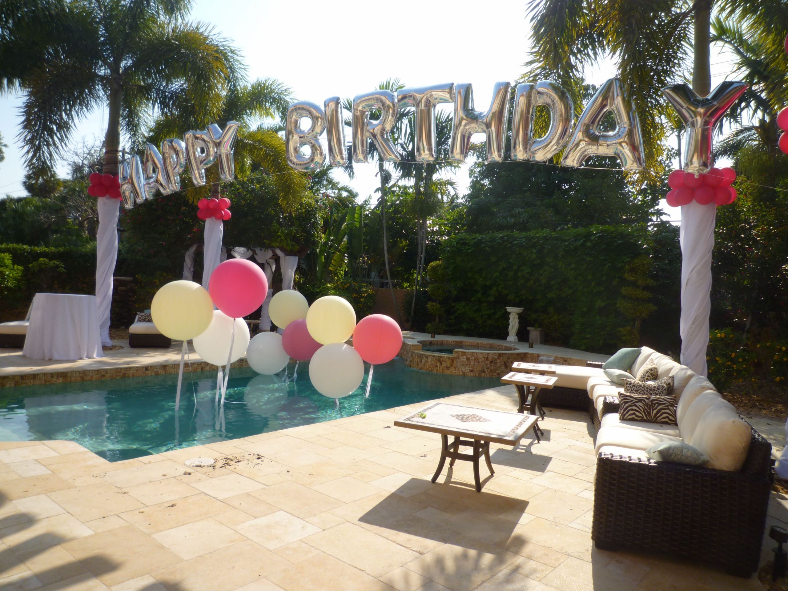 Poolside Party Decoration Ideas
 Birthday balloon arch over a swimming pool Backyard party