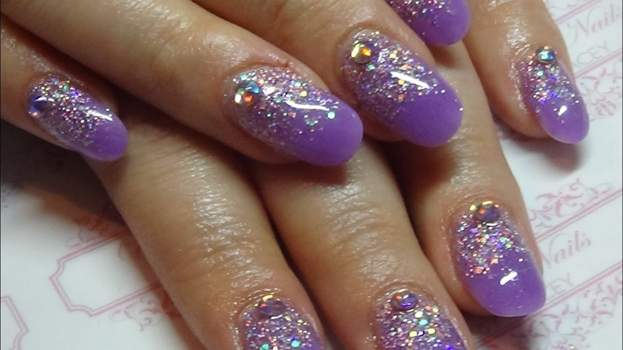 Purple Nails With Glitter
 Purple acrylic nails with a glitter overlay using cjp