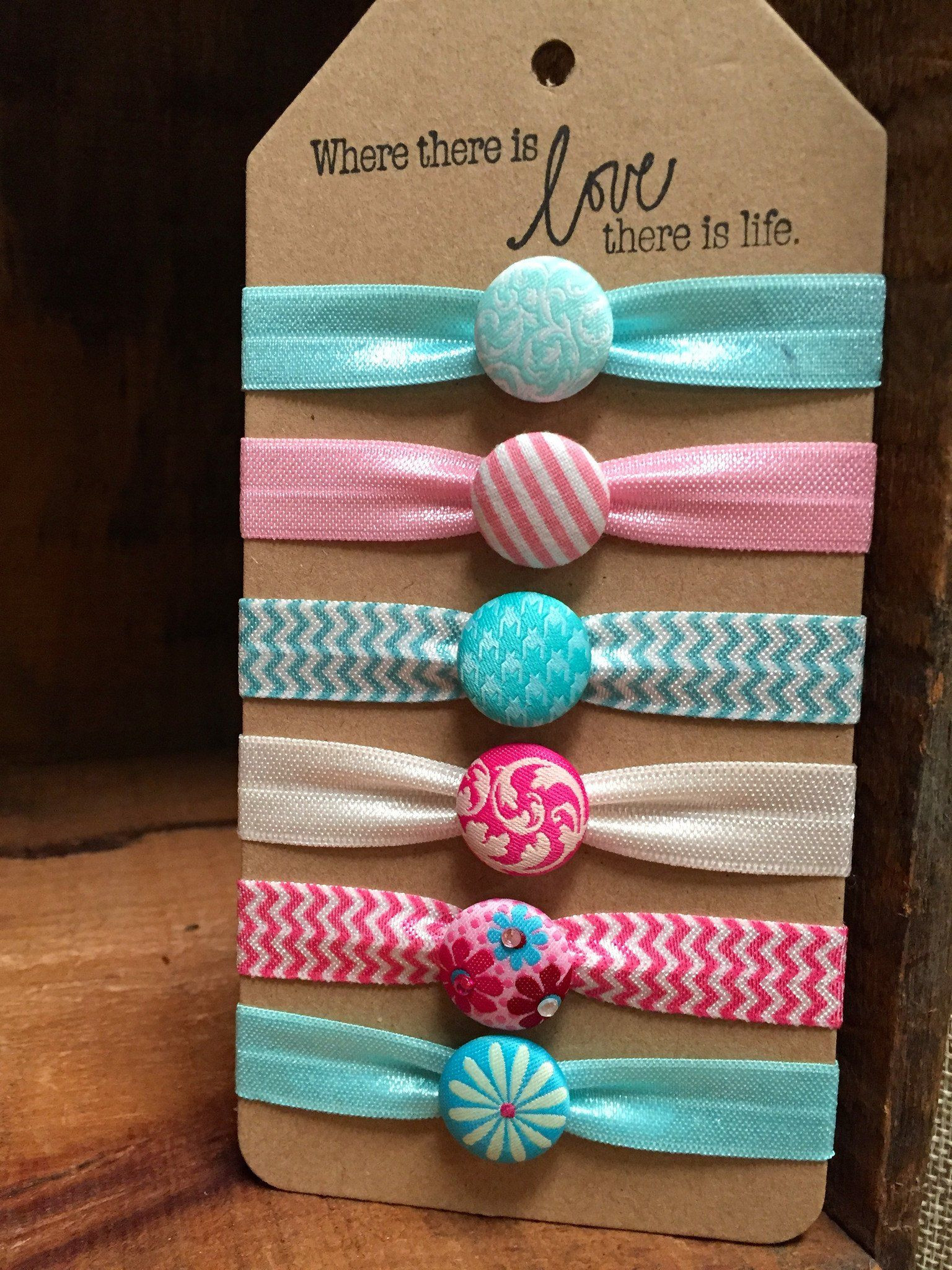 Ribbon Hair Ties DIY
 Set of 6 hair ties each accented with a fabric covered