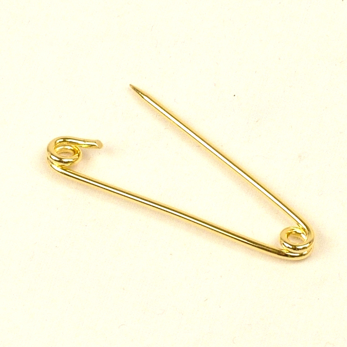 Safety Pins
 Gold collar safety pin which can be used to pierce the collar