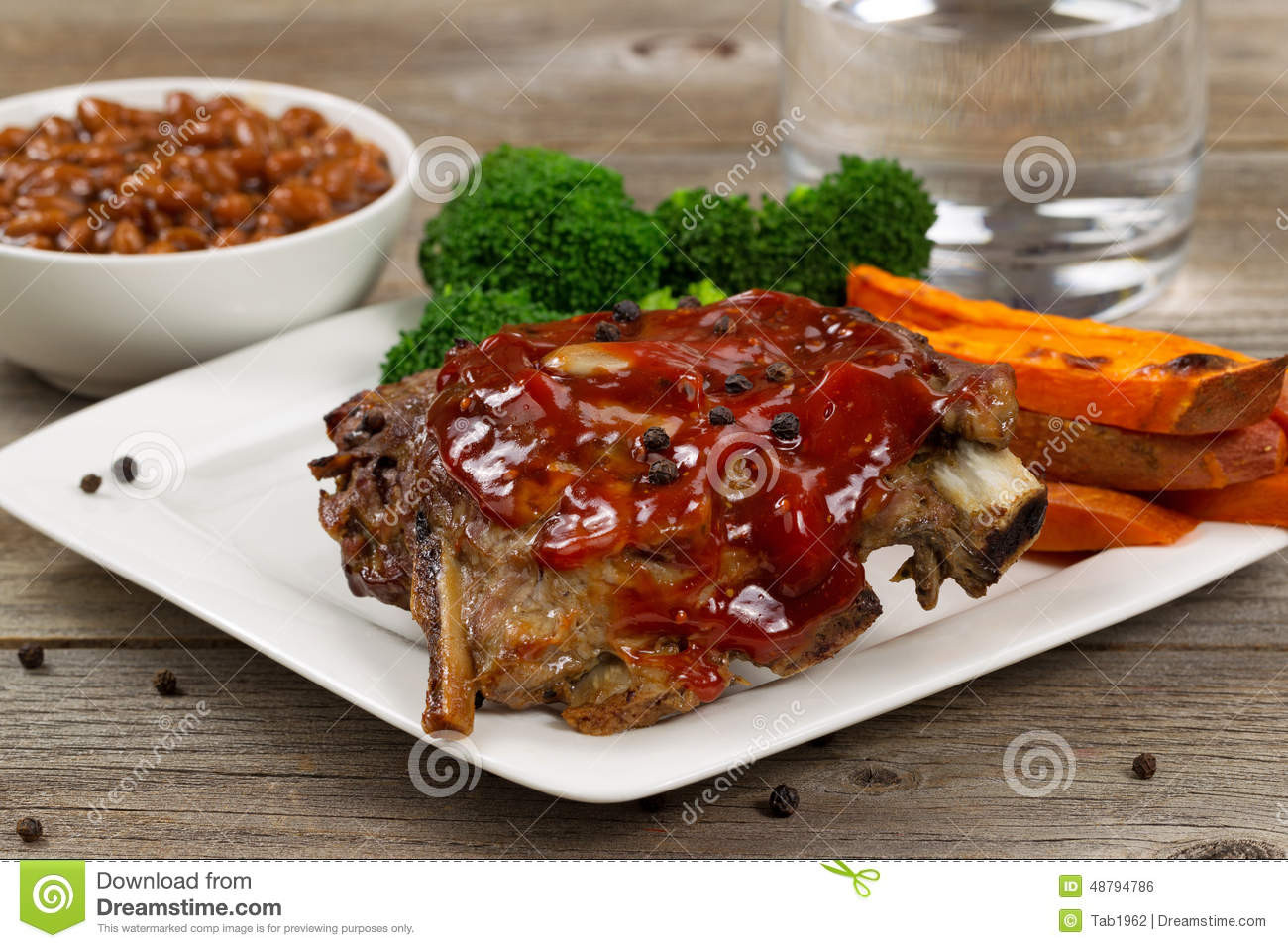 Side Dishes For Barbecue Ribs
 Juicy BBQ Ribs And Side Dishes With Water Stock