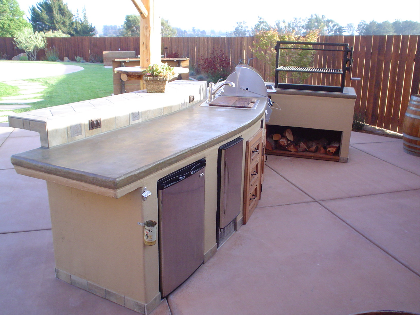 Stucco Outdoor Kitchen
 This island features concrete counter tops with a lace