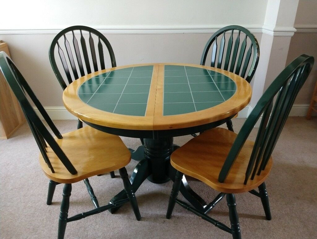 Tile Top Kitchen Table
 Extendable round green tile top dining table with chairs