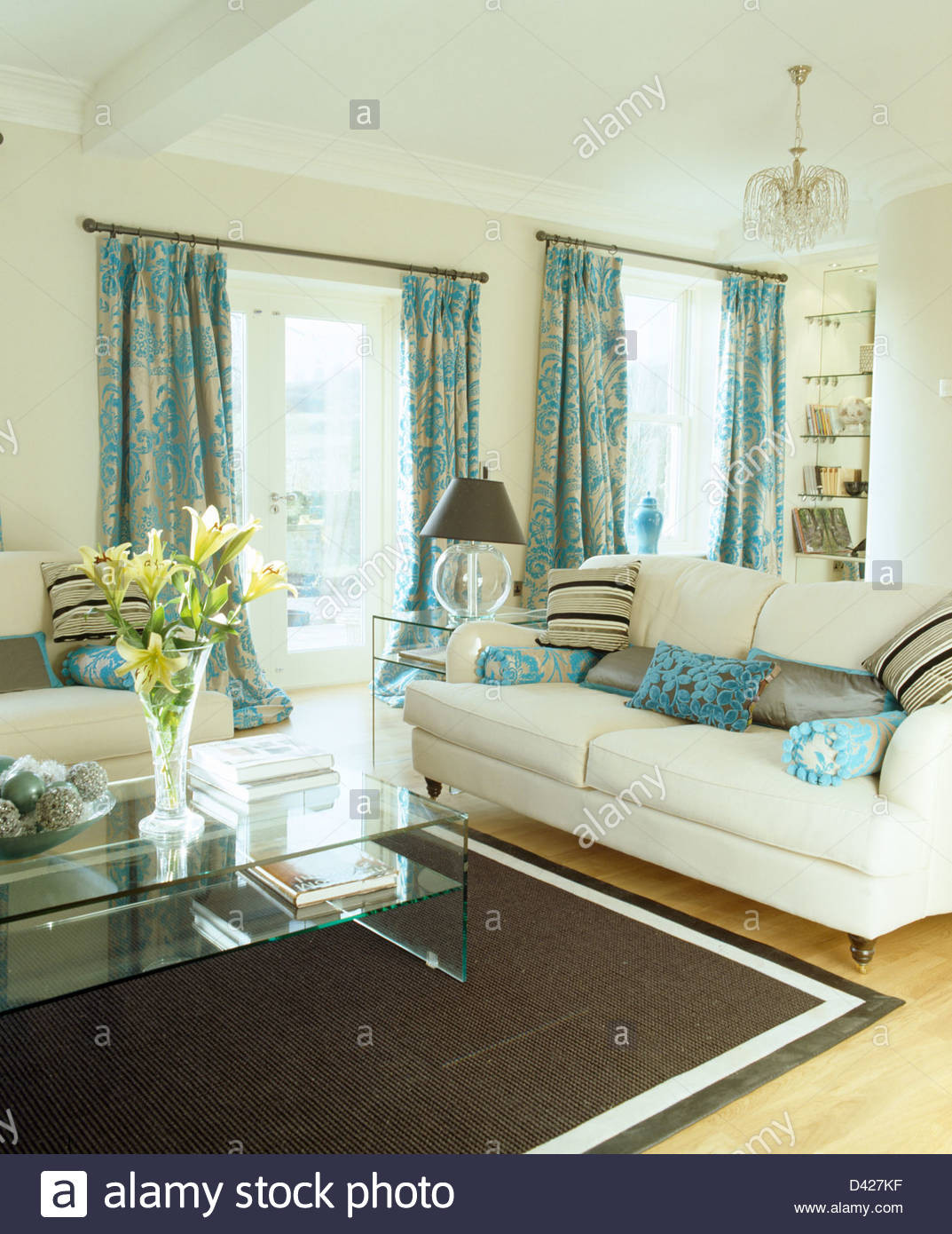 Turquoise Curtains Living Room
 Patterned turquoise curtains and cream sofas in cream