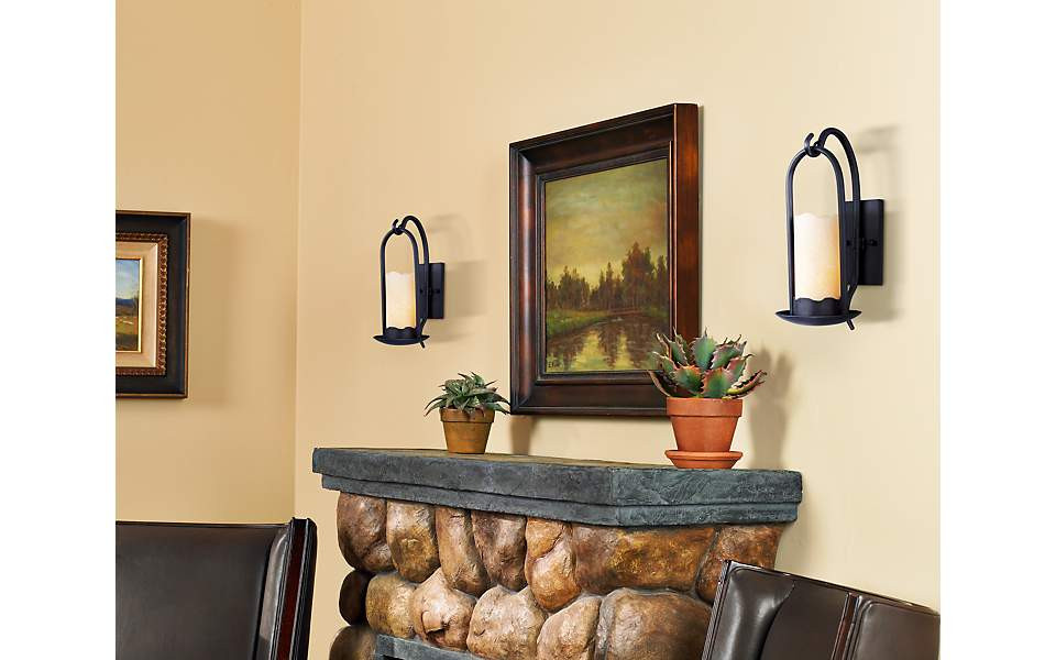 Wall Sconces Living Room
 Rustic wall sconces brighten a living room fireplace